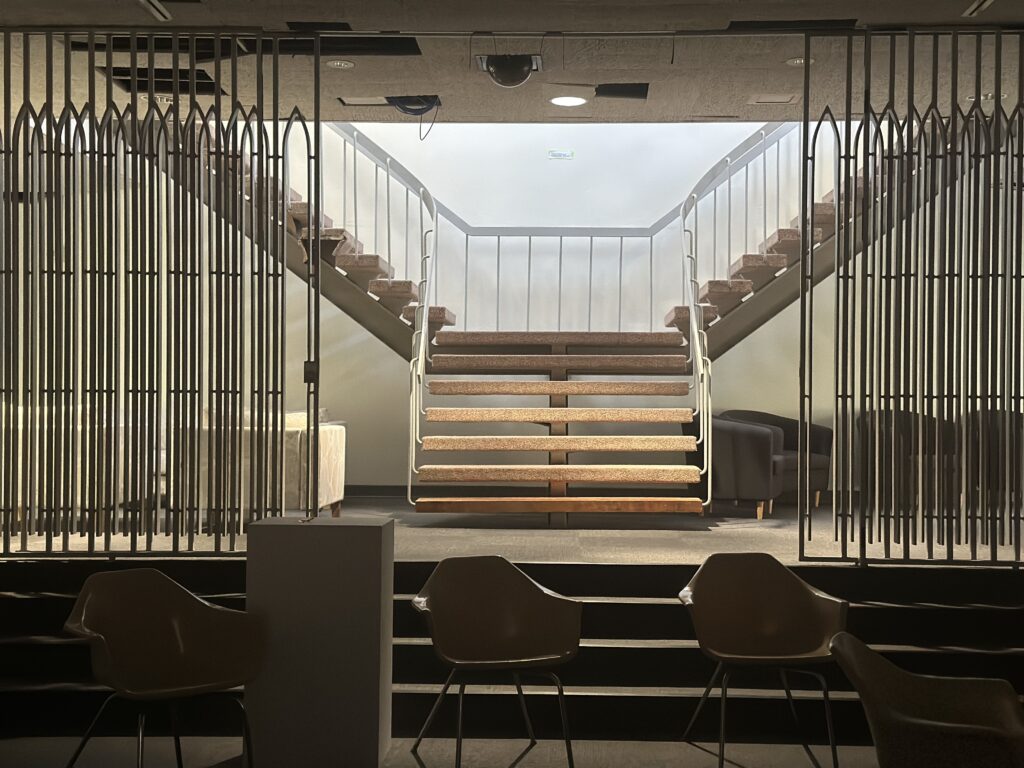 split stairwell, Dana Fine Arts interior, image photographed from the gallery looking west toward the theater